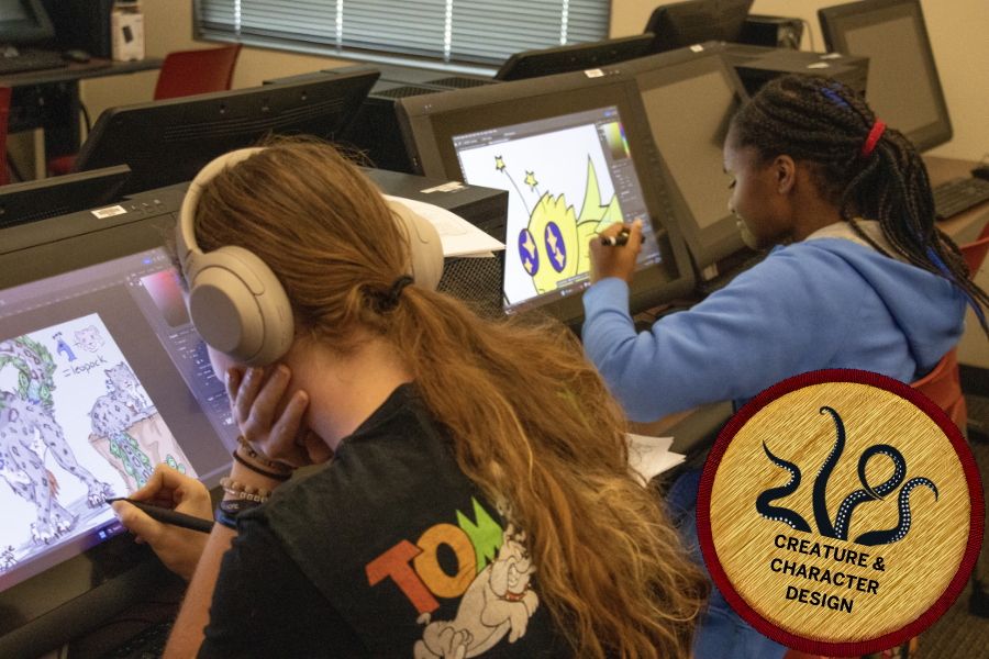 Two students drawing on tablets