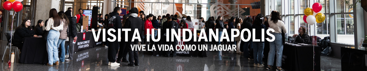 Resource fair at Somos el Futuro with the font Visita IU Indianapolis and Vive la vida como un jaguar on top of photo